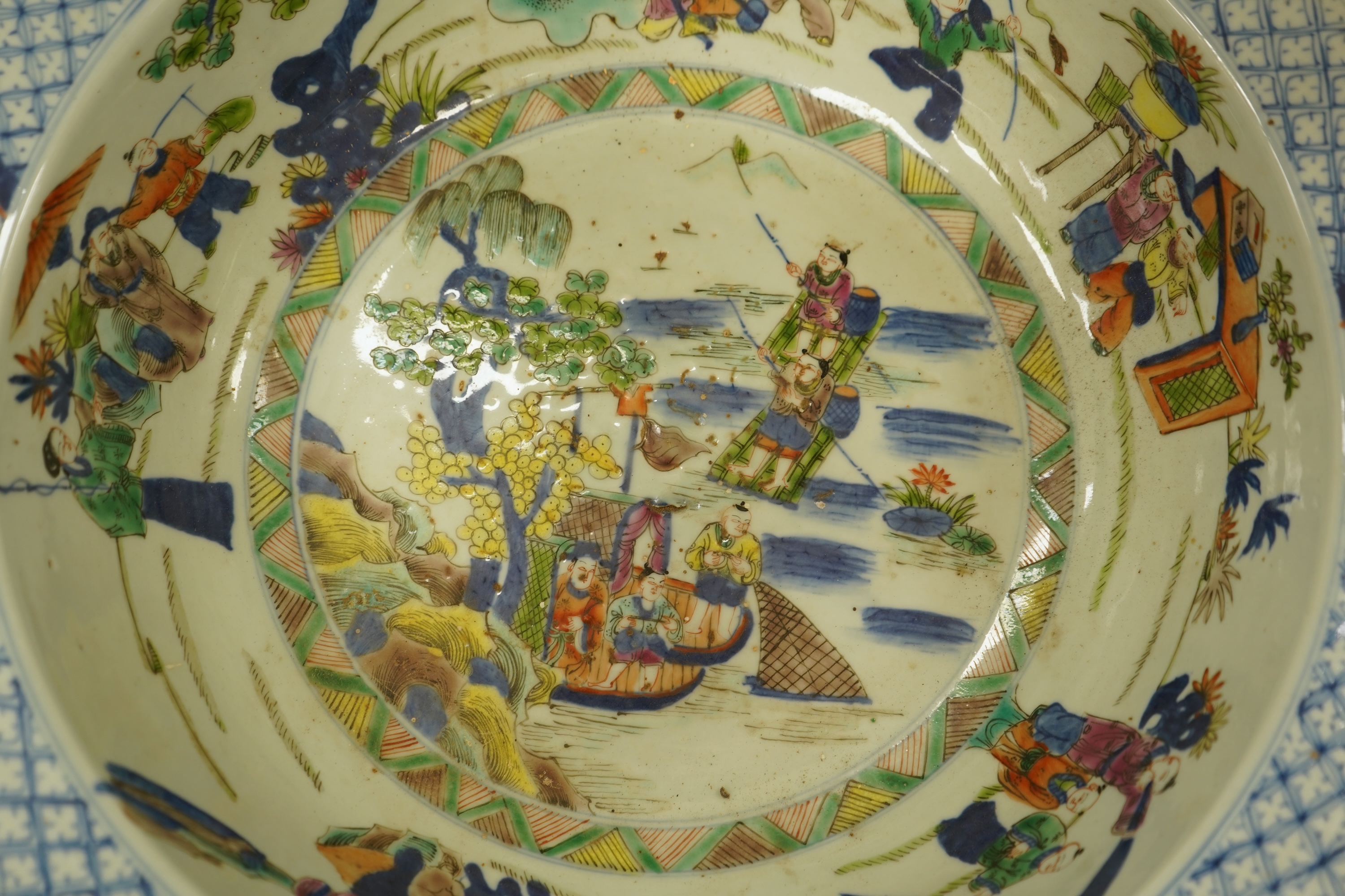 A large Chinese porcelain basin enamelled with figures, 41cm in diameter